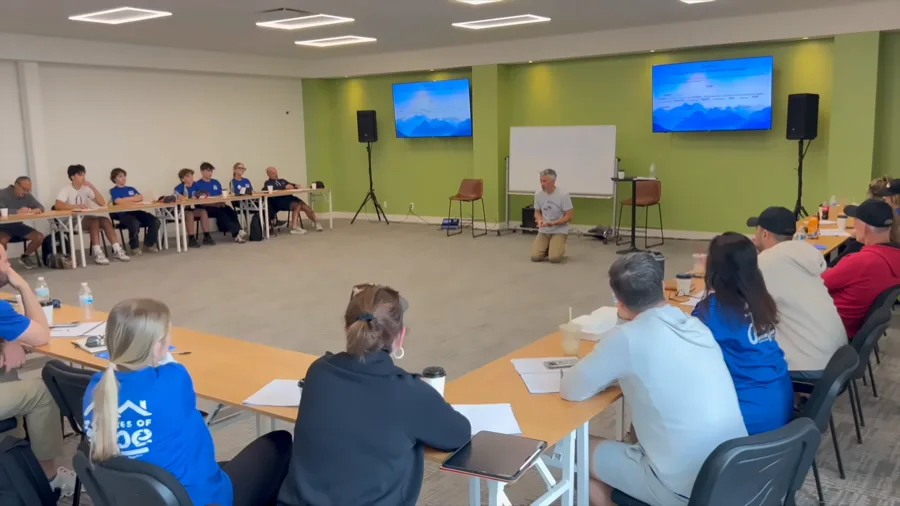 Jim teaching the full group, seated in a circle